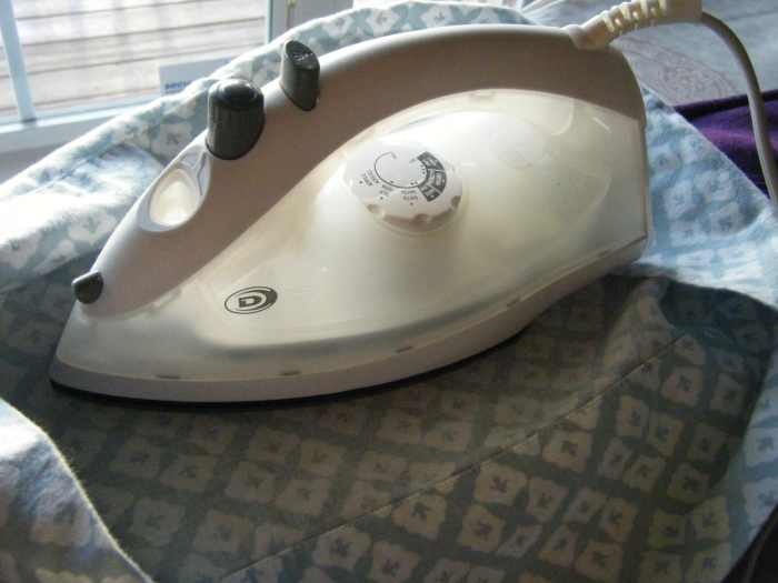 Iron over the fabric.