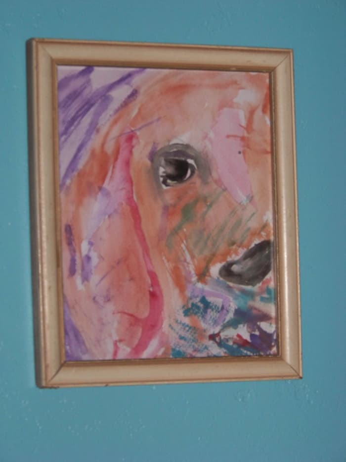 This watercolor is by a 2 yr old student. She water-colored this dog by looking at a black and white computer printout of a similar dog. The basic lines are there: the ear, eye, and nose. The rest is fill-in-the-blank.