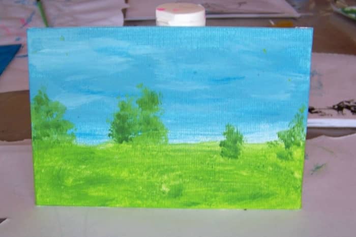 This landscape is by 2 almost 3 yr old, Kashmere. Great job on the trees. Notice how close and far away her trees are creating depth. Kashmere added a little darker color green to her trees once the first color dried with a very small brush.