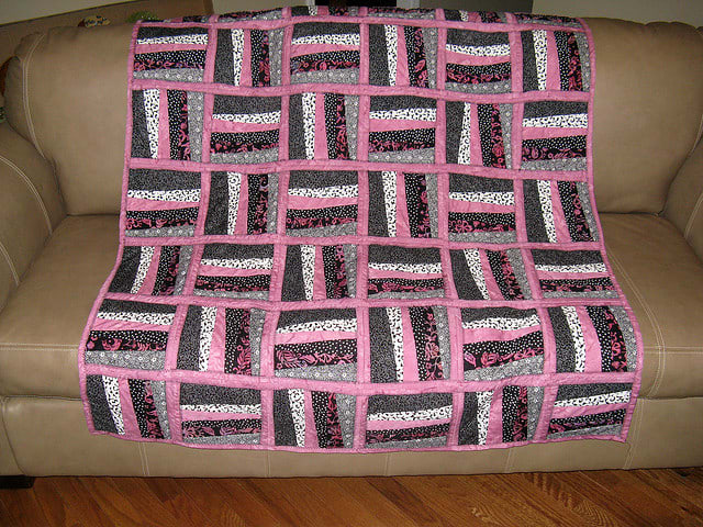 Although not exactly like the quilt she is describing, this quilt gives you an example of stripped pieces laid horizontally and then vertically.