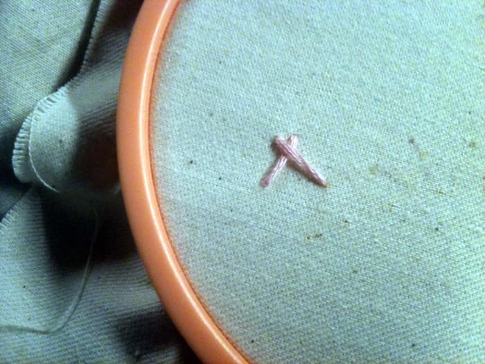Figure 3: Close your straight stitch at the bottom right to form a sort of cross stitched teepee.
