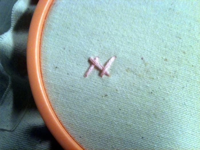 While the first official herringbone stitch was completed with the "teepee" look, this stitch doesn't form its signature look until several are made.