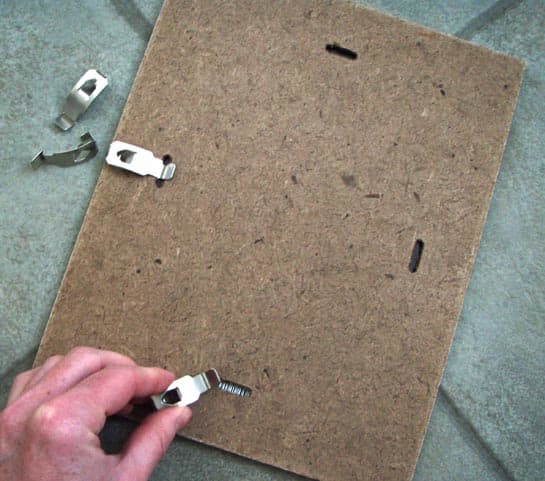 I liked the idea of using these clip frames. They were very inexpensive and once hung, they looked rather attractive.