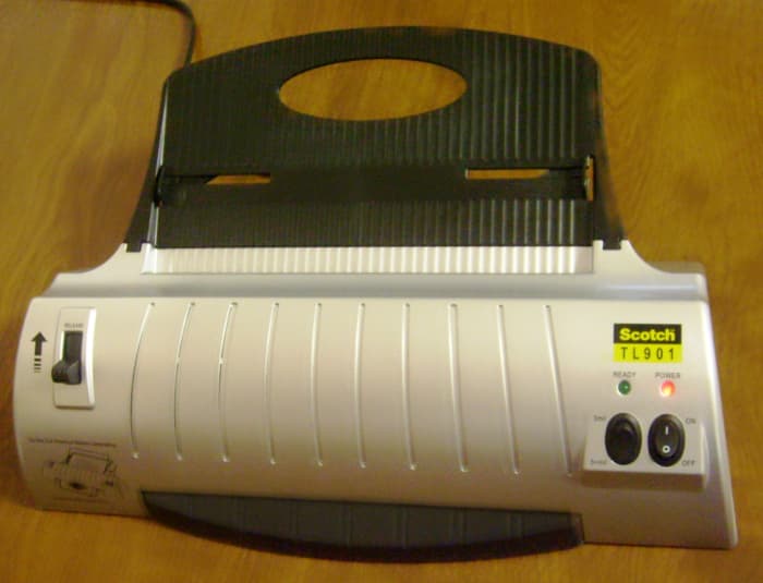 You can use laminating sheets with a machine such as this or choose manual laminating sheets which are sticky on the inside and require a bit more patience.