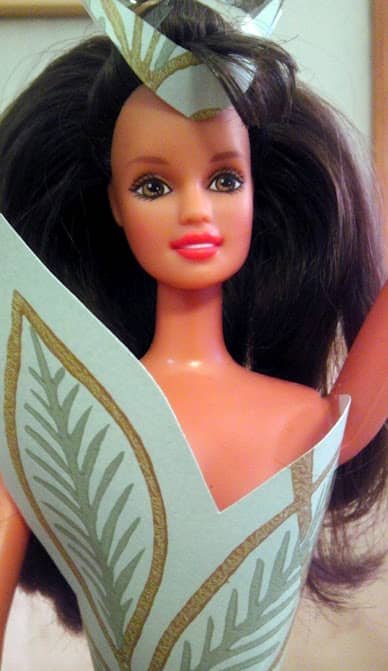 Follow a pattern on the paper for a specialized costume-like bodice and snip a pretty headpiece to complete the outfit.