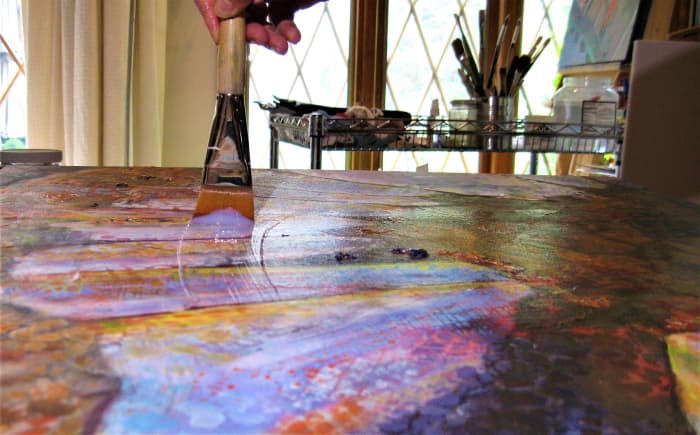 Apply varnish with regular and even strokes, holding the brush at an angle. Be careful not to overwork it, or it will create bubbles and dry foggy.