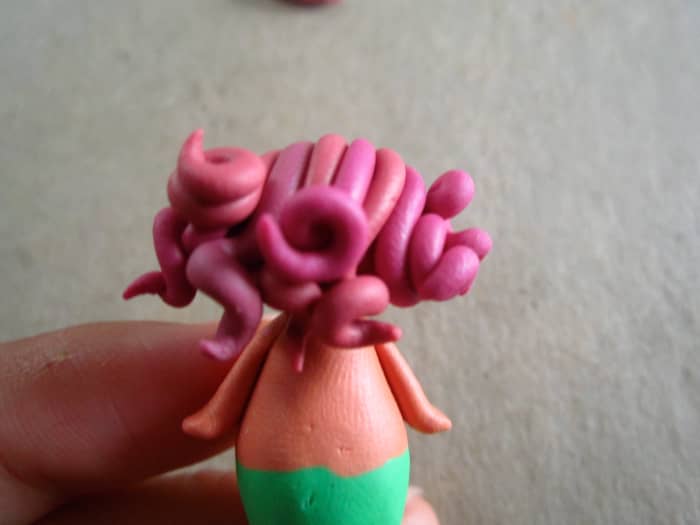I attached the coils to the top of the head and curled the ends gently. (This was my favorite part.)