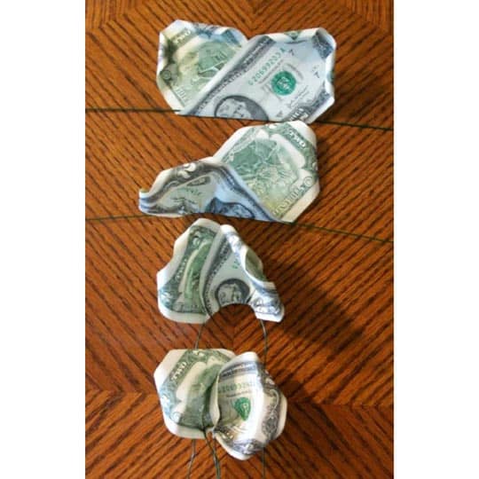 Step 4: Take your time and be patient putting the money onto wires to avoid damaging the bills.