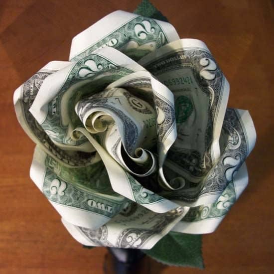 This bloom is made of two-dollar bills. I used six two-dollar bills—five became petals and the sixth became the bud in the center.