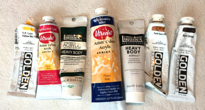 An example of a limited color palette from trusted brands. From left: Cadmium Yellow Medium, Naphthol Red, Phthalo Green (blue shade) Ultramarine Blue, and Titanium White. You can stop here, but I like to add Raw Sienna and Burnt Umber.