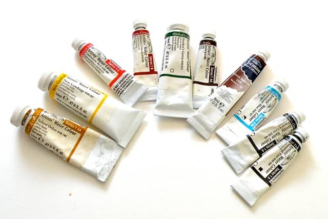 Start with eight to ten basic watercolors. I like Windsor Newton tubes, professional grade.
