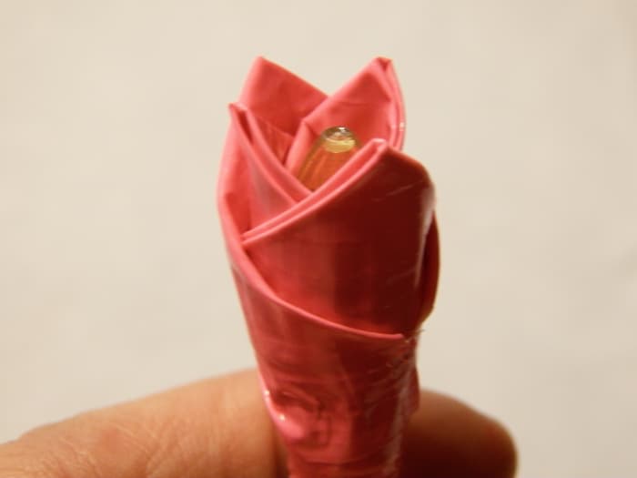 Step 6:Make 2 more petals and add them on the opposite sides of the first two.