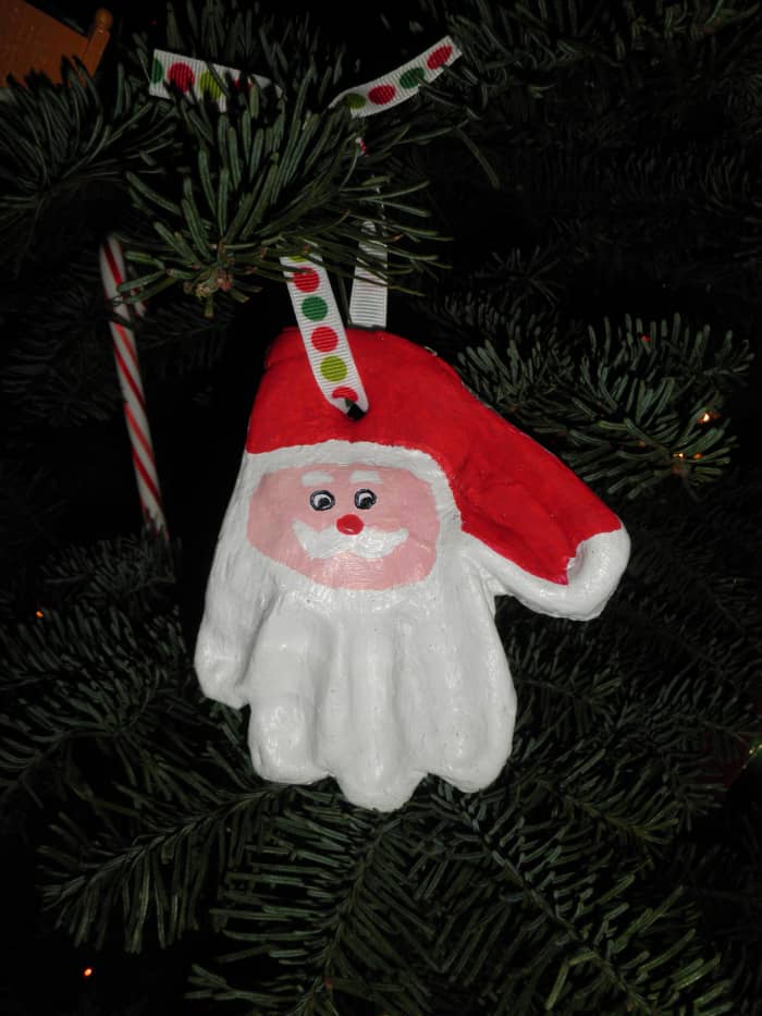 A Santa ornament made from a childs hand-print, Made from the easy to make salt clay dough recipe, just flour, warm water and salt.