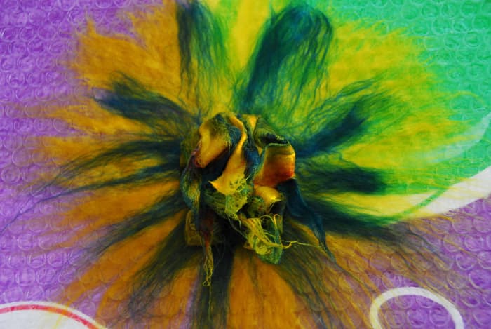 Plastic wrap removed showing the layers which are attached now to the central core of the flower