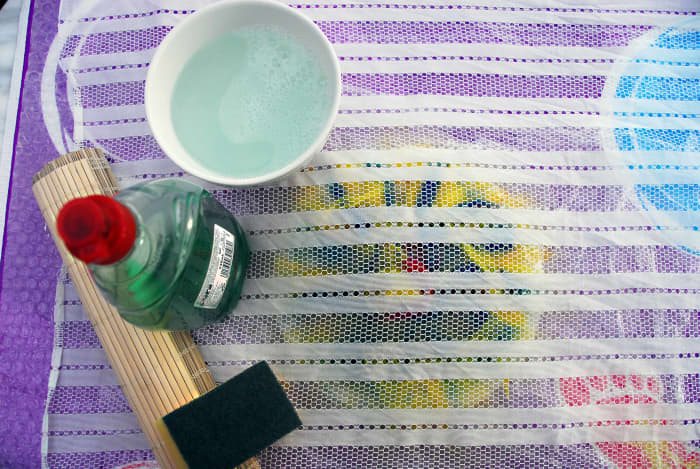 Curtain netting, boiling water, dish washing liquid, a bamboo mat and a sponge are needed now.