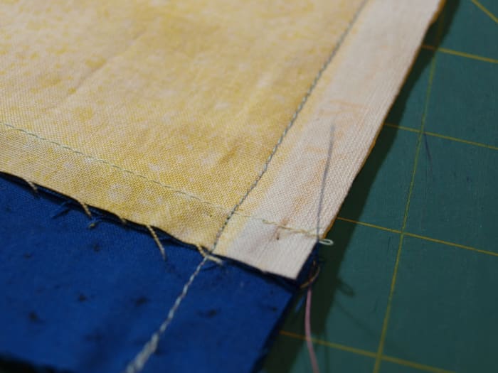 2. Use a 1/2" seam and backstitch at the beginning and end. Sew along the short end.
