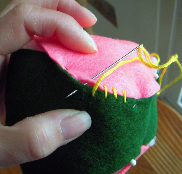 Butt together edges and sew with overhand stitch all the way around. Remove pins as you stitch.