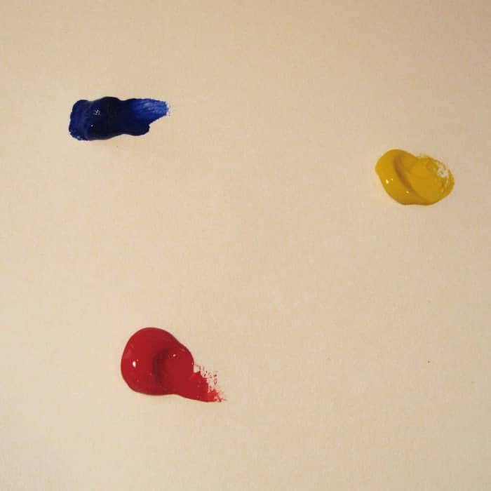 Step 1: I started with three primary colors: Ultramarine Blue, Naphthol Red Medium, and C.P. Cadmium Yellow Medium.