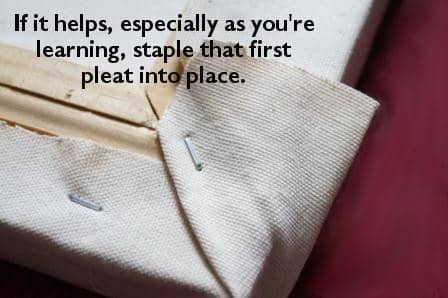 Staple the pleat into place if it helps. That way you have something holding down the fabric when you're dealing with the final flap of canvas.