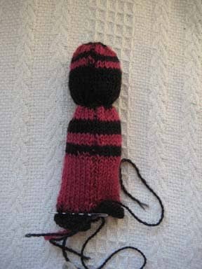 The Comfort Doll's feet are made by drawing a string through, stuffing it and sewing it closed.