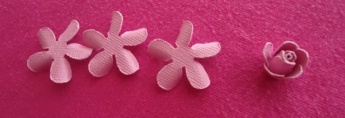 Now you have three left, take one and glue it (curled side of petals pointing down just like in photo) under the first 2.