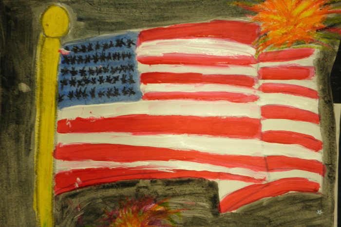 Painting of an American flag with acrylic paint with the fireworks done in oil pastels. Then a watercolor wash was added to the background. Very nice effect!