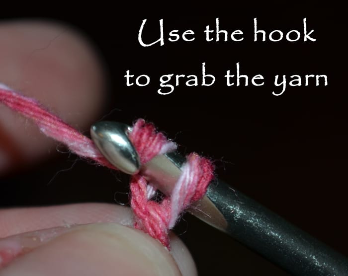 Use the hook to grab the yarn and pull it through the loop that is already on the hook.