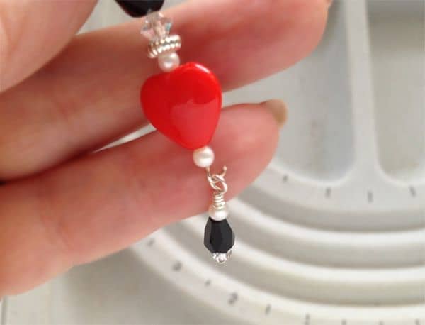 Hang the bottom section of the beaded dangle on the opened eye pin loop of the upper section