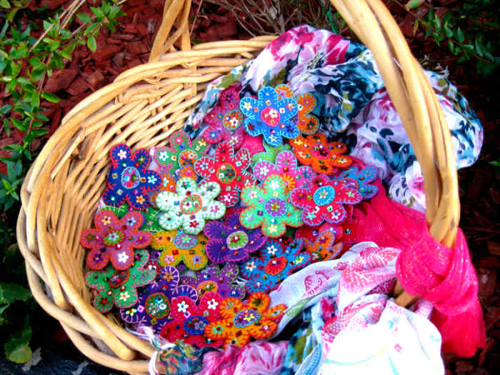Make lots of different coloured felted flowers and walk around with them outdoors to attract people's attention.