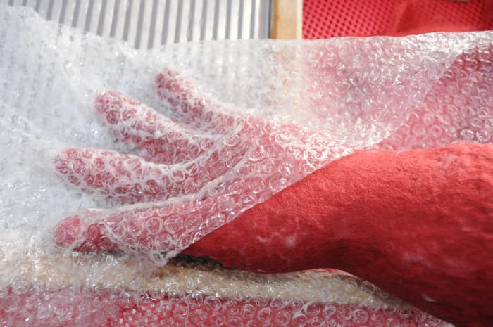 Cover fingers with bubble-wrap and push down between the fingers. Rub with your fingers for several minutes.
