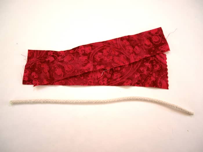 I did not have long strips of this fabric so I used 2 strips and a length of cord for this bracelet.