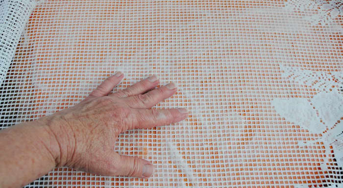 Force the hot soapy water outwards towards the edges and then rub gently until smooth