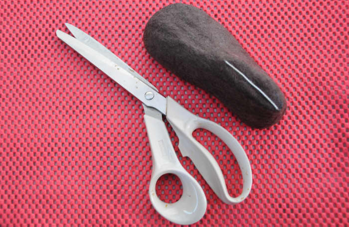 15. Cut where indicated with a sharp pair of scissors. Gently slip the bootie off the last.
