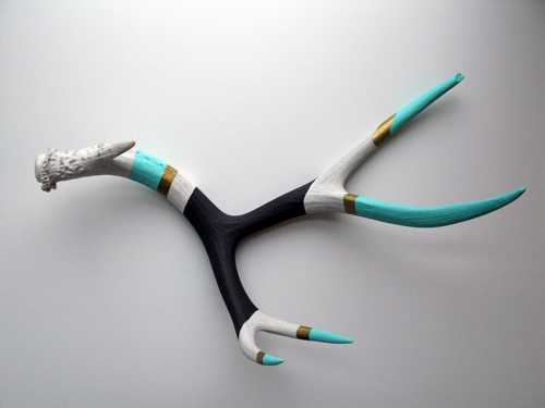 The artist here used combinations of matte and metallic acrylic paint to gussy up some otherwise drably colored antlers.