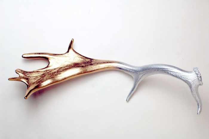 Not all antlers need to be Southwestern in style. This Fallow deer antler was covered in metallic silver and gold spray paint to achieve a beautiful, shiny gradient.