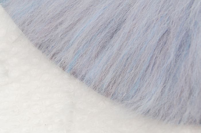This image shows the final layer of wool fibers being taken to the edge but not over it.