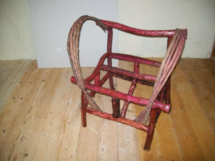 Chair frame with back support and arm benders in place. The front slanted brace can be seen in this picture.