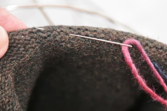 Place the liner into the basket, right sides outside and fold the top edge over the edge as shown.