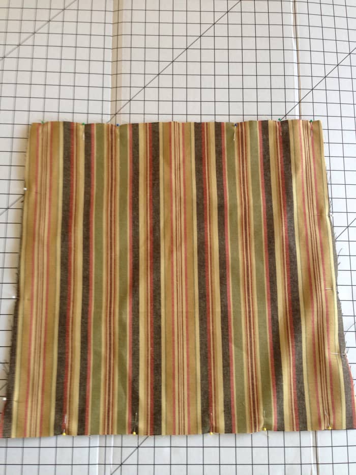 Stitch top and bottom pieces together, right sides together, with ties sandwiched inside. Leave an opening in the back edge for turning right-side-out.