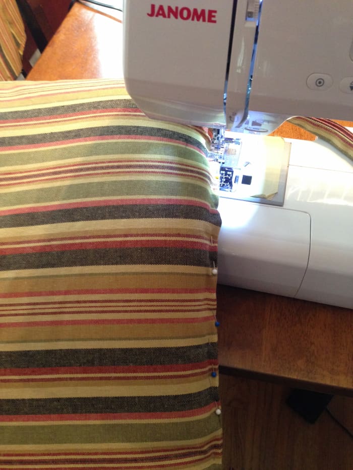 Since my cushions were rather thin, I decided to stitch the cover closed on the machine. It took a bit of wrestling and a lot of pins, so if you don't want to do this you can sew the opening closed by hand using a slip stitch.
