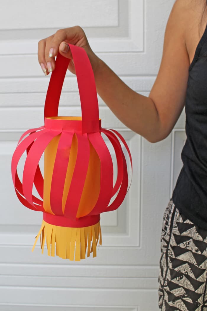 The strips in this Chinese paper lantern have a round effect because the top and bottom were folded, which allowed the strips to balloon out.