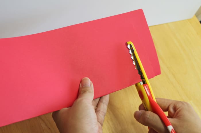 Do the same kind of cuts you did for the simple Chinese lantern, but use the special edging scissors instead.