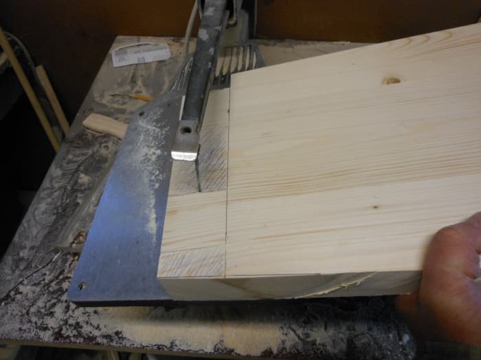 Cutting the tenons on a scroll saw. To insure a good fit with the joinery, it is a good idea to make the tenons just slightly larger than needed and then shave off the excess wood for a great fit.