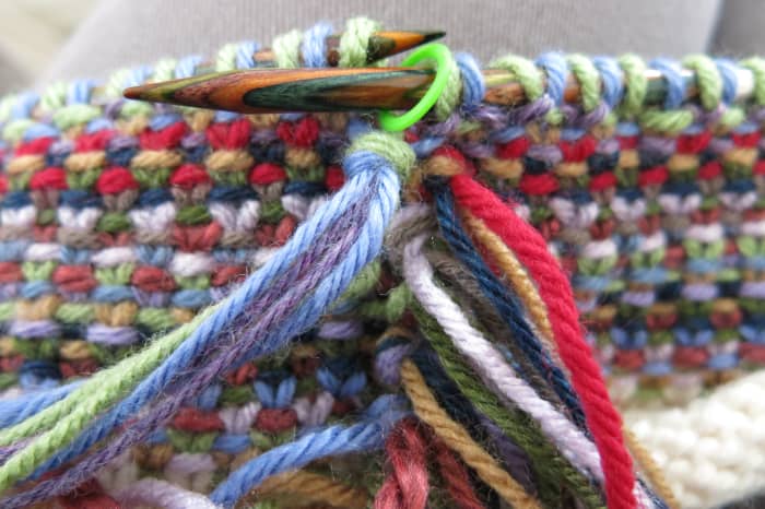 Wrap the strands around your finger to form a loop, and pull your ends through the loop.