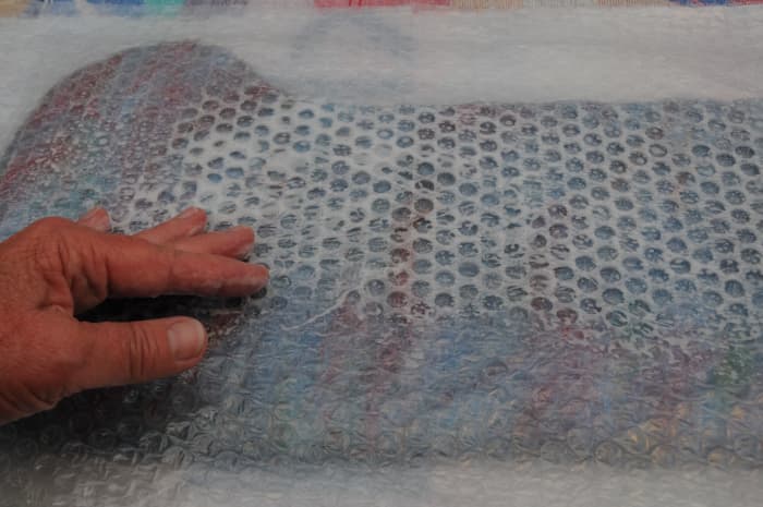 Wet the Bubble-wrap with warm soapy water and rub firmly before the final rolling on a Bamboo Blind. If no Blind is available rub using the Bubble=wrap. It will take longer.