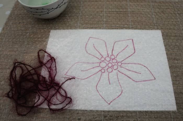 The largest template with some contrasting mohair knitting yarn used for making the veins of the leaves.
