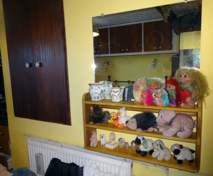 Cupboard recessed in brick wall above the stairwell, which prevented fitting a new radiator shelf when I replaced the old radiator with a new taller one.
