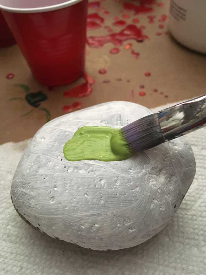 Plan to do two coats of paint onto each stone's face. This will increase opacity and will help the marker last longer outside.