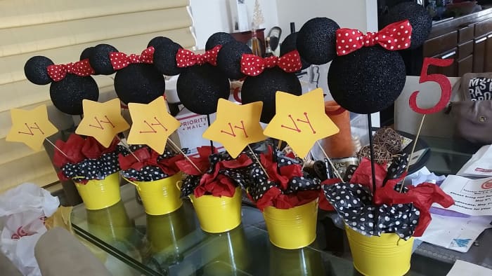 Minnie Mouse centerpiece: Another cute idea using polka dot tissue paper and colorful flower pots!