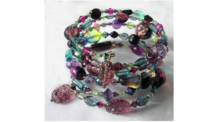 One-of-a-kind coil bracelet designed by Margaret Schindel features a mix of contemporary and vintage glass beads on memory wire